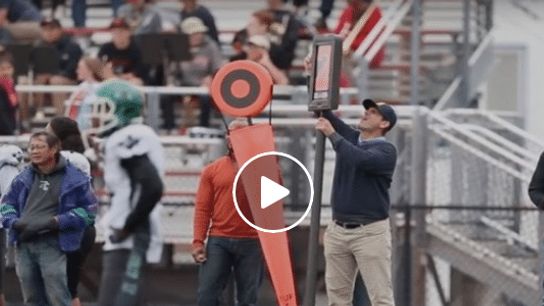 Watch: Jim Harbaugh works the chain gang while on a recruiting trip (Featured)