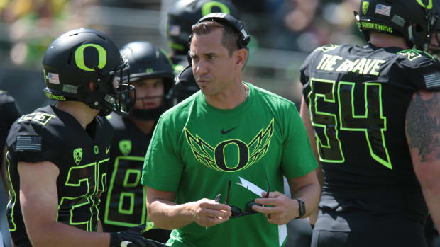 Apr 29, 2017; Eugene, OR, USA; Oregon wide receiver Chayve Maday (28) talks with co- offensive coordinator coach Marcus Arroyo at Autzen Stadium. Mandatory Credit: Scott Olmos-USA TODAY Sports