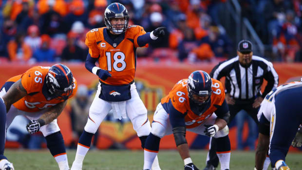 DENVER, CO - JANUARY 12:  Peyton Manning #18 of the Denver Broncos calls a play in the second half against the San Diego Chargers during the AFC Divisional Playoff Game at Sports Authority Field at Mile High on January 12, 2014 in Denver, Colorado.  (Photo by Doug Pensinger/Getty Images)