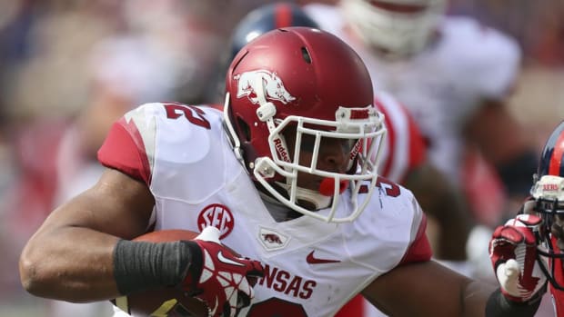 Nov 9, 2013; Oxford, MS, USA; Arkansas Razorbacks running back Jonathan Williams (32) advances the ball during the game against the Mississippi Rebels at Vaught-Hemingway Stadium. Mandatory Credit: Spruce Derden-USA TODAY Sports