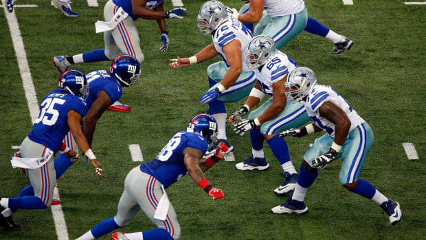 The Dallas Cowboys offensive line, including Dallas Cowboys tackle Tyron Smith (77),  guard Ronald Leary (65), center Travis Frederick (72), guard Zack Martin (70) and tackle Jermey Parnell (78) block the New York Giants in the first quarter at AT&amp;T Stadium in Arlington, Texas, Sunday, October 19, 2014. (Tom Fox/The Dallas Morning News) 12262014xSPORTS