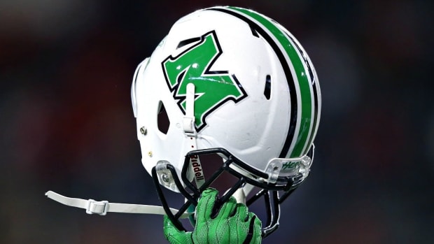 Sep 30, 2017; Cincinnati, OH, USA; A player of the Marshall Thundering Herd holds his helmet to celebrate the touchdown by tight end Ryan Yurachek (not pictured) against the Cincinnati Bearcats in the second half at Nippert Stadium. Mandatory Credit: Aaron Doster-USA TODAY Sports