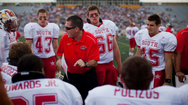 wfca15 spt caw  Coaches talk to their players in huddle during the Division 1-3 High School All-Star football game on Saturday, July 14, 2012 at Titan Stadium in Oshkosh, Wis.  PHOTO BY CHRIS WILSON/CWILSON@JOURNALSENTINEL.COM