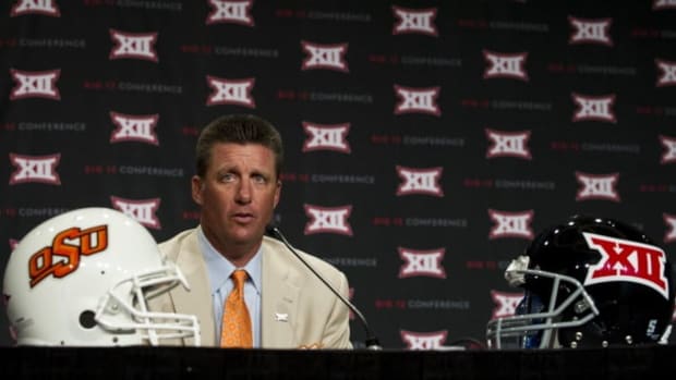 DALLAS, TX - JULY 21:  Oklahoma State head coach Mike Gundy speaks during the Big 12 Media Day on July 21, 2014 at the Omni Hotel in Dallas, Texas.  (Photo by Cooper Neill/Getty Images)