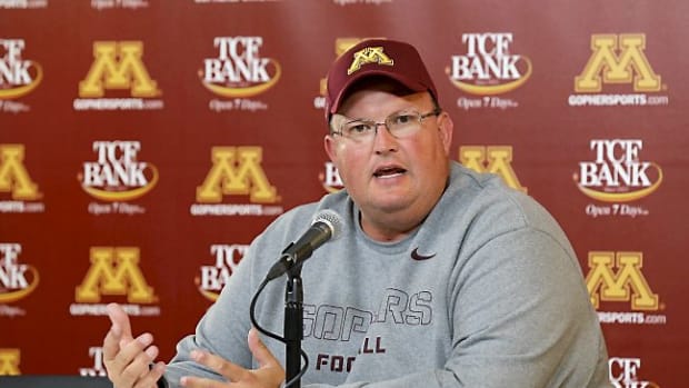 Minnesota defensive coordinator Tracy Claeys speaks during the post-game press conference after an NCAA college football game against Western Illinois in Minneapolis Saturday, Sept. 14, 2013. Head coach Jerry Kill left the game after an epileptic seizure, and Claeys, who was in the press box,  took over Kill's decision-making duties from the booth. Minnesota beat Western Illinois 29-12. (AP Photo/Ann Heisenfelt)