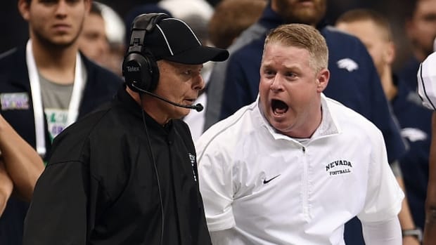 NEW ORLEANS, LA - DECEMBER 20:  Head coach Brian Polian of the Nevada Wolf Pack objects to an officials call during the R&amp;L Carriers New Orleans Bowl against the Louisiana-Lafayette Ragin Cajuns at the Mercedes-Benz Superdome on December 20, 2014 in New Orleans, Louisiana.  Louisiana-Lafayette won the game 16-3.  (Photo by Stacy Revere/Getty Images)