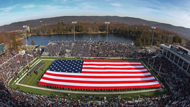 Nov 22, 2014; West Point, NY, USA; West Point cadets display a giant American flag during a halftime ceremony honoring the military at Michie Stadium between the Army Black Knights and the Fordham Rams. Mandatory Credit: Danny Wild-USA TODAY Sports