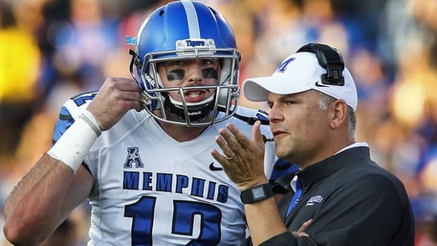 September 12, 2015 - Memphis quarterback Paxton Lynch (left) and head coach Justin Fuente (left) discuss a play during first quarter action in Lawrence, Kansas. (Mark Weber/The Commercial Appeal)