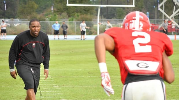 Georgia interim head coach Bryan McClendon watches a drill during the Bulldogs' TaxSlayer Bowl practice on Tuesday, Dec. 29, 2015, in Jacksonville, Fla. (Photo by Patrick Nealis)