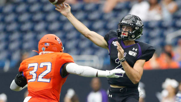 Stephen F. Austin Lumberjacks quarterback Trae Self (2) throws the ball in the first half as Sam Houston State Bearkats linebacker Royce See (32) adds pressure during Battle of the Piney Woods at NRG Stadium on Saturday, Oct. 5, 2019.