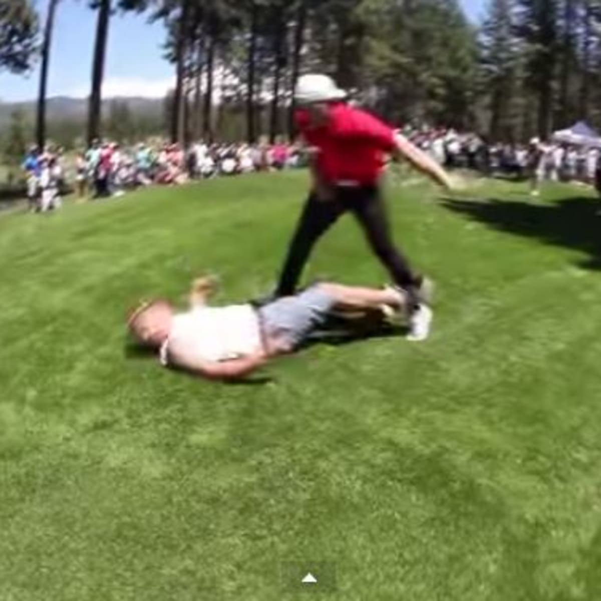 A.J. Hawk lays the wood on a fan at golf tournament