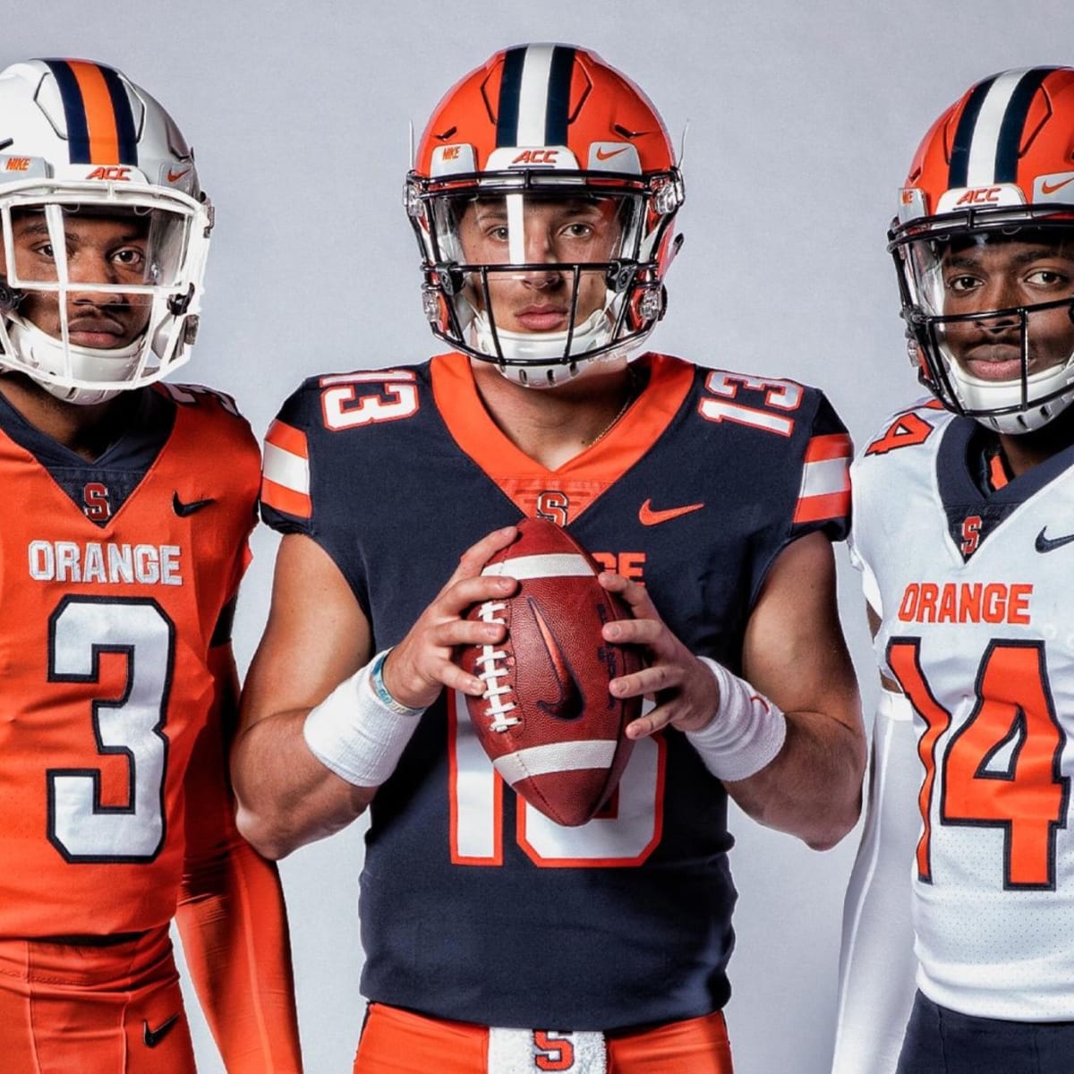 Syracuse wearing orange helmets, white jerseys & white pants v