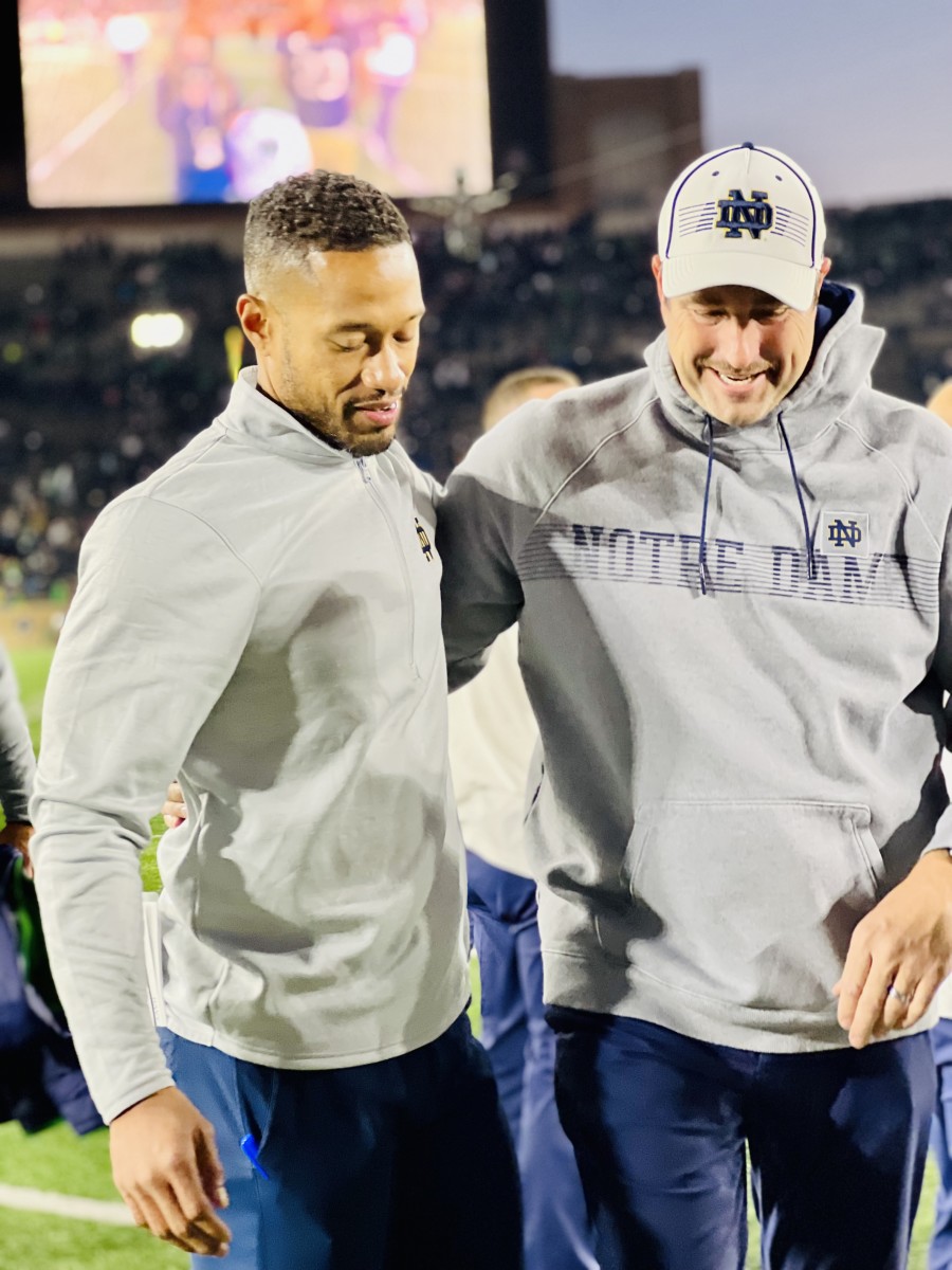 Despite losing three linebackers to season-ending injuries and All-American safety Kyle Hamilton for an indefinite period of time, Marcus Freeman (left) and Mike Elston (right) are optimizing Notre Dame's defense. 