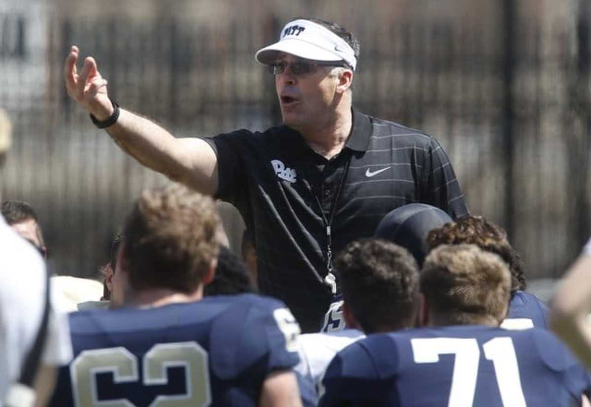 First year Pittsburgh head football coach Pat Narduzzi, center, talks with the team before their NCAA college Blue Gold spring football game, Saturday, April 18, 2015, in Pittsburgh. (AP Photo/Keith Srakocic)