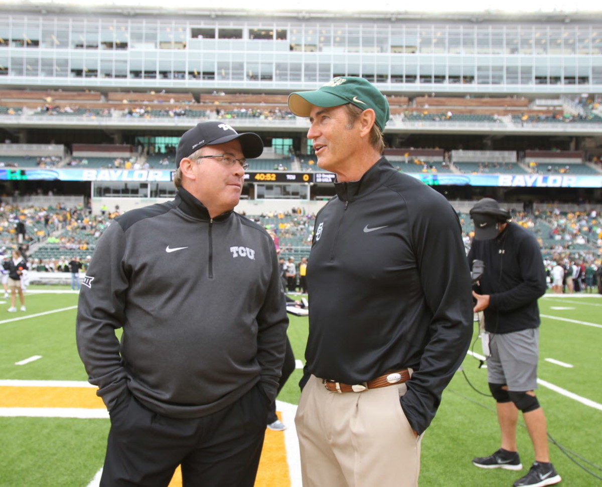 Baylor coach Art Briles, right and TCU Gary Patterson talks before their NCAA college football game, Saturday, Oct. 11, 2014, in Waco, Texas. (AP Photo/Jerry Larson) 04222015xSPORTS