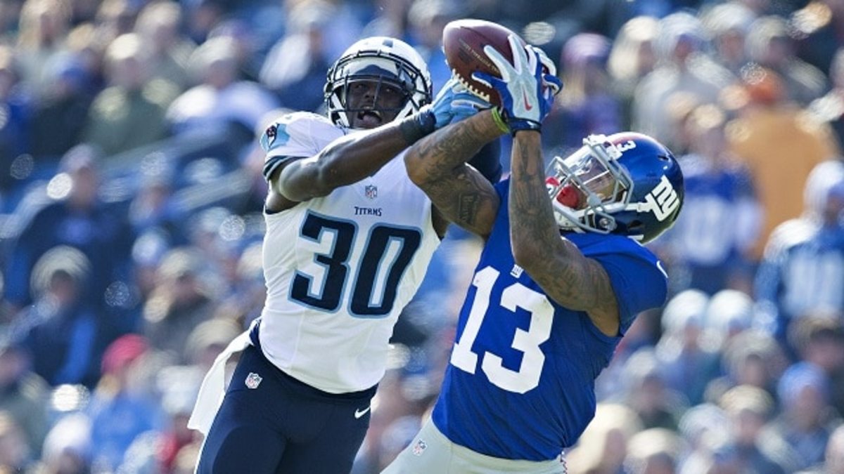 NASHVILLE, TN - DECEMBER 7:  Odell Beckham Jr. #13 of the New York Giants catches a pass in the first half while being defended by Jason McCourty #30 of the Tennessee Titans at LP Field on December 7, 2014 in Nashville, Tennessee.  (Photo by Wesley Hitt/Getty Images)