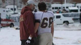 A Massachusetts HS coach is taking a stand and refusing to coach until his player is cleared to play (stand)