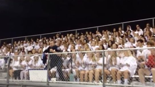 Video: Cop leads cheer in high school student section (high schools)