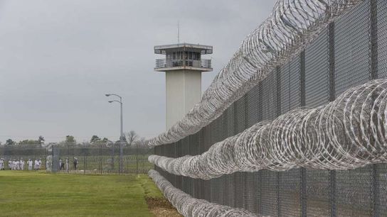 A D-II assistant is facing some serious federal prison time after being arrested on drug and gun charges