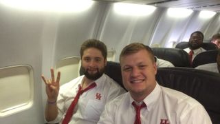 Houston boosters used to fly first class with the team, but under Tom Herman, first class is for the lineman (Featured)
