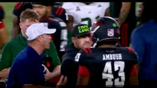 Tom Herman chases after Alex Golesh following South Florida's dominant win (Tom Herman)