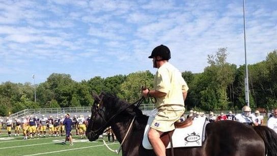 Photo: Brian Kelly showed up to today's practice on a horse (Notre Dame)