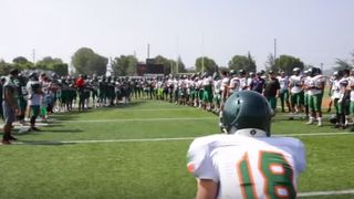 Video: Watch a college president put on the pads and go out to practice with the team (California)