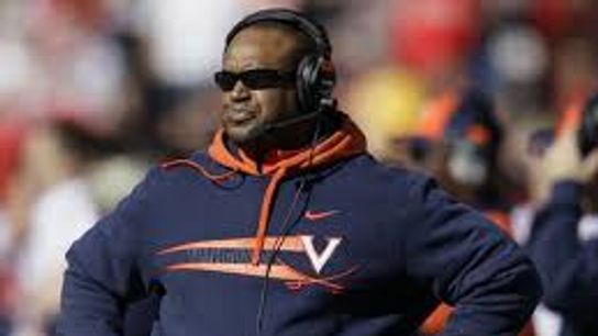 Mike London donned a different hat each quarter to honor each branch of the military yesterday