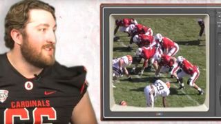 Ball State players critique game film of head coach Mike Neu from his playing days (Ball State)