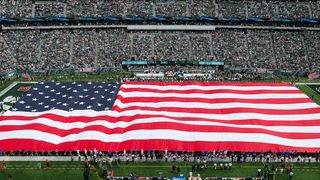 One college football team has kicked a player off the team for kneeling for the National Anthem (Featured)