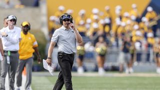 West Virginia and Neal Brown have agreed to a contract extension (West Virginia)