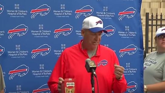 Watch Rex Ryan and Bills owner Terry Pegula eat dogs treats for charity (Rex Ryan)