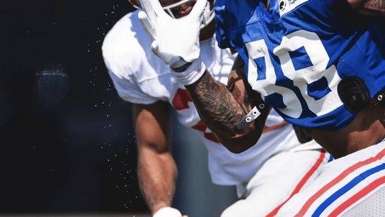 Why do players on this NFL team have tennis balls taped to their hands? (tennis balls)