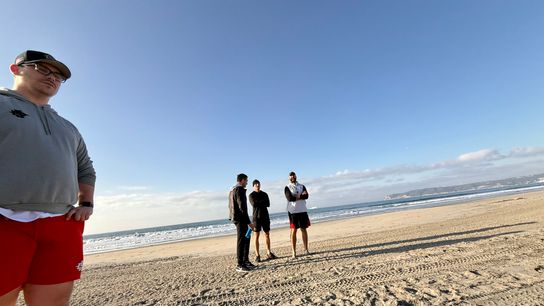 San Diego State G.M. Caleb Davis, near, watches the conclusion of a drill while in background head coach Sean Lewis visits with ex-NHL player Corey Tropp. San Diego State G.M. Caleb Davis, near, watches the conclusion of a drill while in background head coach Sean Lewis visits with ex-NHL player Corey Tropp.